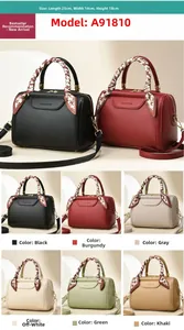Detail of multi-color crossbody bags in lychee leather texture with silk scarf decoration