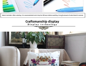 Close-up of fabric markers and DIY floral coloring details on white pillowcase