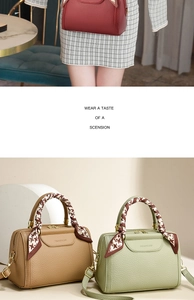 Close-up of litchi texture leather Boston bag with decorative houndstooth silk scarf handle