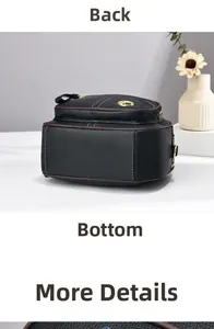 Dettaglio della mini borsa in pelle nera con cuciture bianche a contrasto e finiture dorate