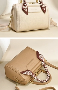 Detail of Boston bag featuring lychee texture leather and stylish houndstooth silk scarf handle