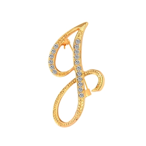 Detailed view of golden letter J brooch with sparkling crystals and metal pin back