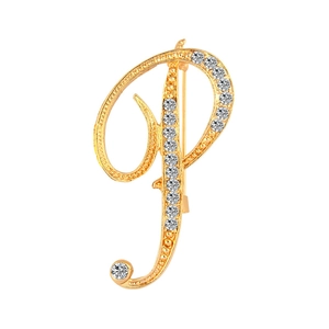 Detail of golden letter P brooch featuring intricate beadwork and sparkling rhinestones