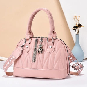 Elegant pink quilted faux leather shoulder bag for women with cute bear pendant and wide strap