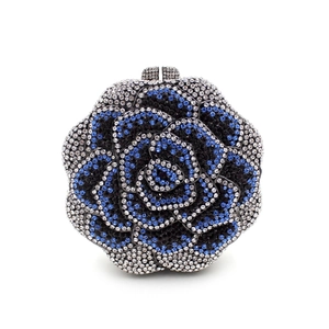 Elegant flower-shaped crystal evening clutch bag with blue and silver rhinestones