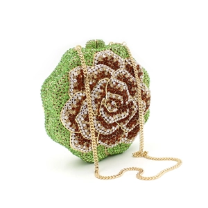 Detail of flower shaped evening bag with green and brown rhinestones and gold chain