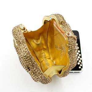 Sparkling gold heart rhinestone evening clutch bag with metallic interior shown open