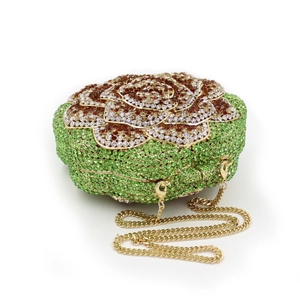 Detailed macro view of green and gold rose-shaped crystal clutch with metal chain