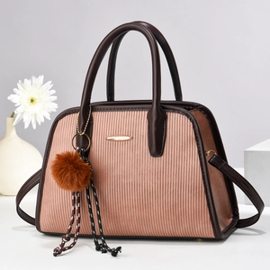 Elegant pink striped tote bag with brown leather handles and decorative tassel ornament