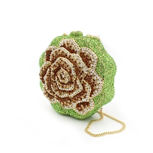 Exquisite floral evening bag featuring green crystals and a gold metal chain strap