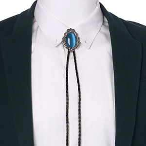 Detail of silver crown bolo tie with turquoise stone and black braided leather rope