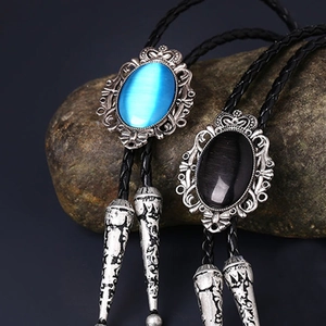 Macro detail of silver bolo tie with blue and black agate stones and woven leather rope