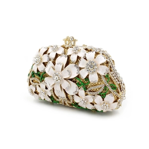Close-up of luxury flower evening bag with crystals and green enamel vine details