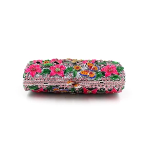 Detail of flower and butterfly evening bag with pink enamel and sparkling crystals