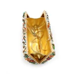 Detailed interior view of the rhinestone evening bag with golden chain strap