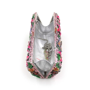 Detail view of the crystal evening bag interior with silver metal chain strap