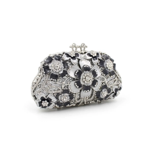 Detailed side view of floral crystal evening bag with black enamel and silver rhinestones