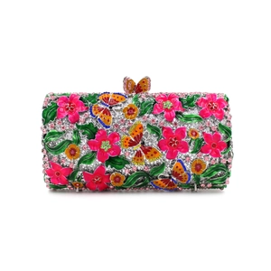 Macro detail of luxury evening bag featuring colorful rhinestones and floral enamel work