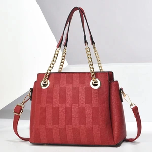 Red pebbled leather handbag with woven pattern and gold chain decoration for women