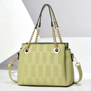 Minimalist avocado green crossbody bag with lychee texture and gold chain strap handle
