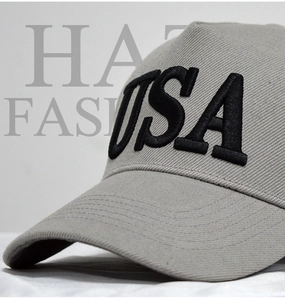 Close-up of a grey baseball cap featuring premium 3D black USA embroidery detailing
