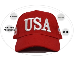 Close-up of a red cotton baseball cap featuring 3D white USA embroidery and side patches