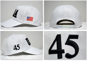 Detail view of white cotton baseball cap with USA and 45 embroidery and flag patch