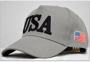 Detail view of grey cotton baseball cap with 3D USA embroidery and American flag patch