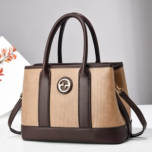 Contrast stripe patchwork handbag with top handles and adjustable shoulder strap