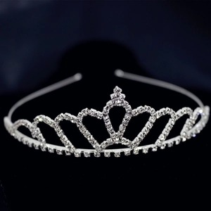 Close-up of elegant silver princess crown headband with shimmering crystal rhinestones