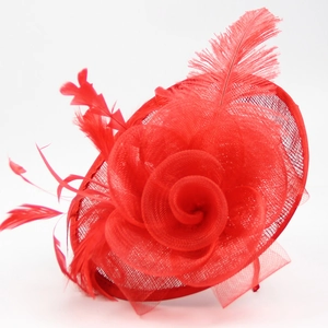 Detailed view of elegant red mesh fascinator with feather floral decor for weddings