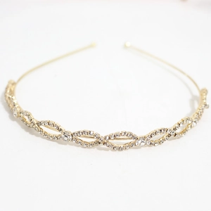 Elegant gold metal headband with sparkling clear rhinestones in a woven link chain design