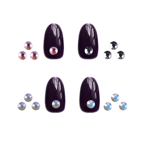 Deep purple oval acrylic nail tips set with round rhinestones and assorted crystals