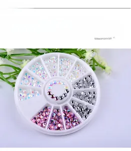 Flatback iridescent rhinestones for nail art displayed in a multi-grid storage wheel case