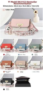 Detail view of stylish crossbody bag with heart metal lock and floral embroidered strap