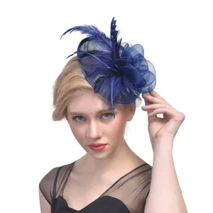 Elegant navy blue fascinator with mesh netting and feathers for wedding party attire