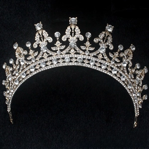 Detailed view of ornate bridal crown with sparkling crystals and vintage filigree pattern