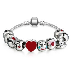 Close-up of silver snake chain bracelet featuring colorful emoji beads and a red enamel heart