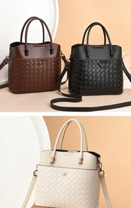 Detailed view of women's woven patchwork handbags in brown black and beige colors