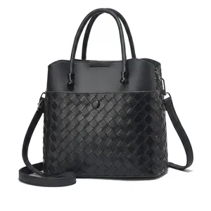 Detailed size specifications of black woven leather tote bag with smartphone comparison