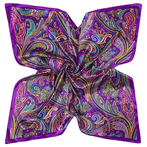 Detailed macro view of purple silk-like paisley pattern scarf with narrow rolled edges
