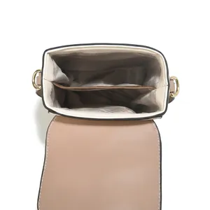 Detail view of the interior layout featuring main and side pockets with grey fabric lining