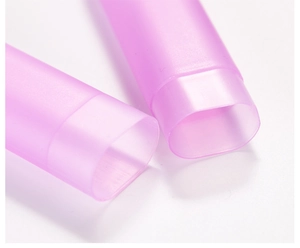 Macro shot of pink translucent oval storage tubes with a matte frosted plastic texture