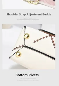 Detail of cream leather bag showing adjustable gold buckle and protective bottom studs