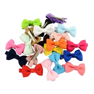 Detail of colorful grosgrain ribbon hair bows with silver metal alligator clips for girls