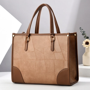 2025 stylish camel tote bag with geometric patchwork and brown leather trim detailing