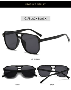 Detail view of black square sunglasses with double bridge and gold rivet accents
