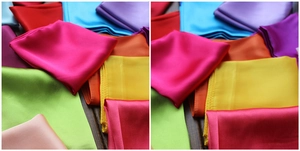 Vibrant 60x60cm solid color silk square scarves displayed on a dark wood background