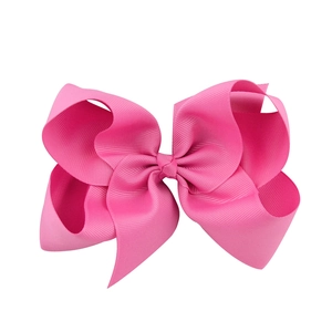 Bright pink 6-inch grosgrain ribbon bow hair clip for girls with ribbed texture