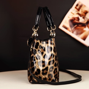 Chic leopard print glossy tote bag with black handles and golden metal rings for women